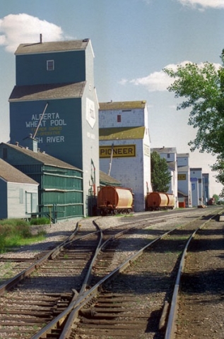 Photograph of wooden grain elevators at High River, Alberta