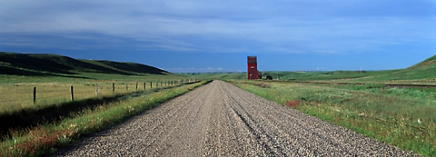 Panoramic photograph of wooden grain elevator at McNab, Alberta