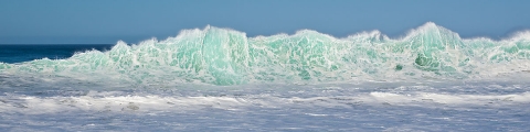 Ocean waves, seascapes, sandy beaches, blues and greens , foam and wave spray,  rolling waves, see through waves.