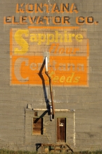 Logo on wooden grain elevator at Sipple, Montana